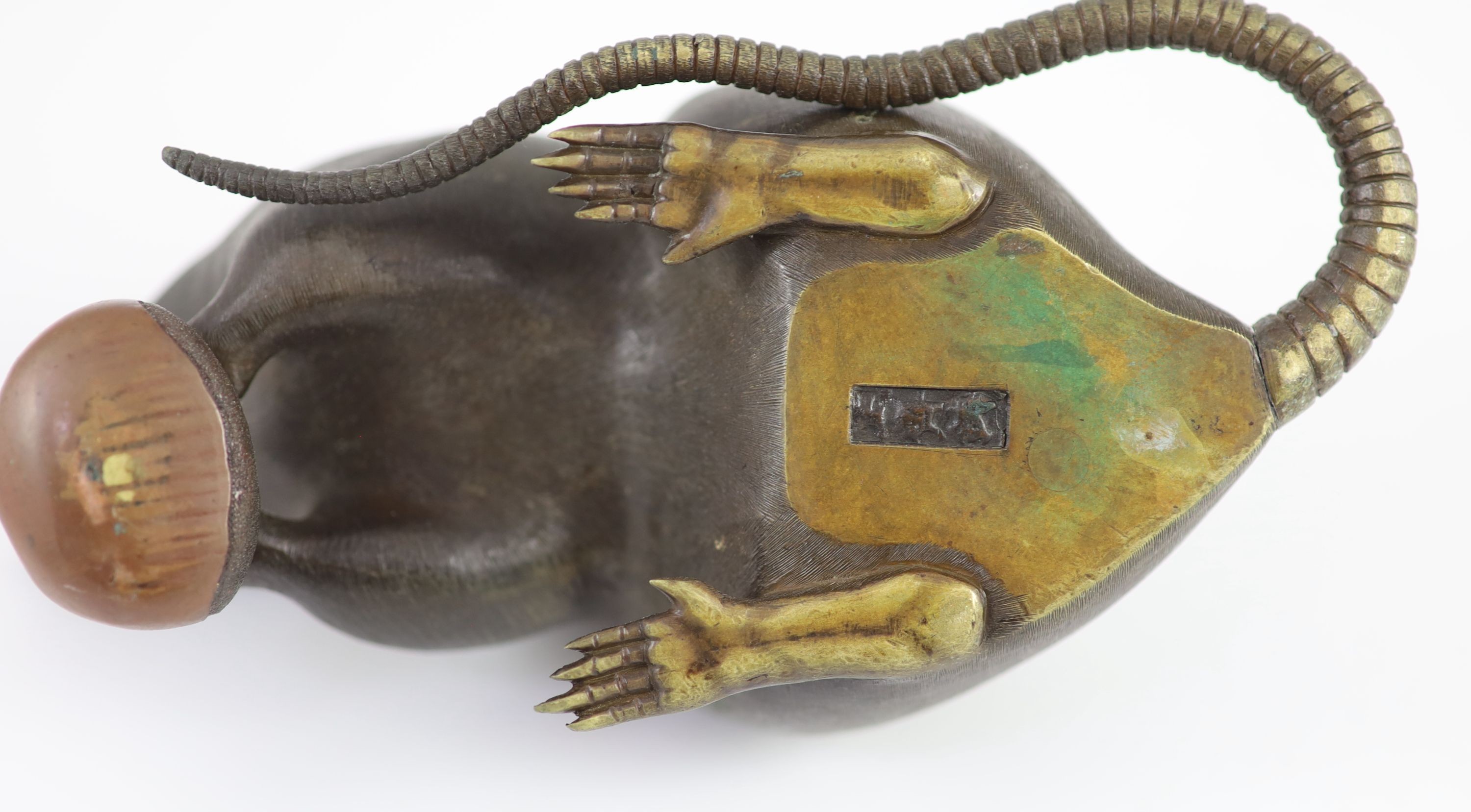 A Japanese two colour bronze figure of a rat, Meiji period, signed Seishu, 18cm long